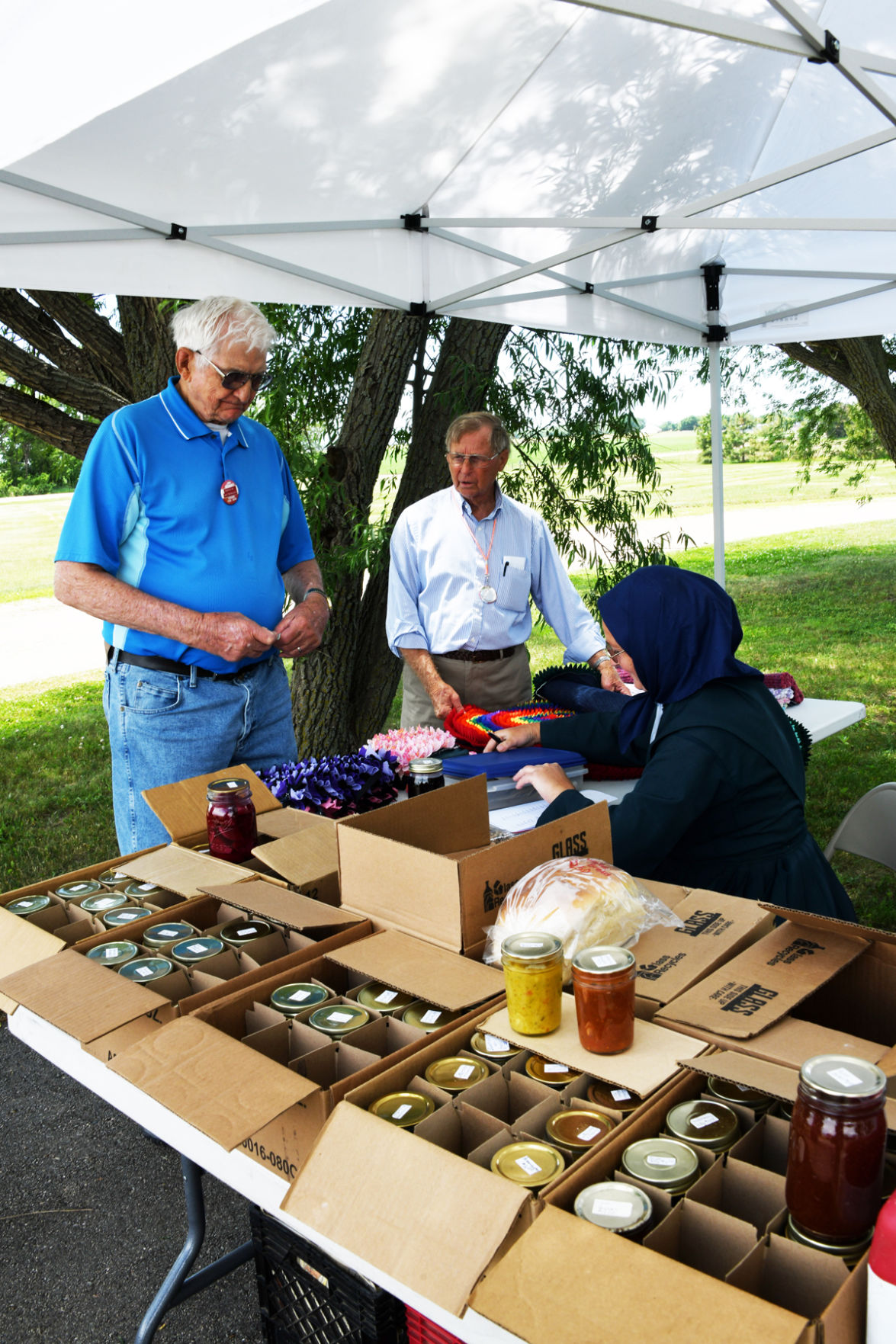 181 Darwin Petersen and Walt Goertzen find some treasures at the Amish tables.JPG